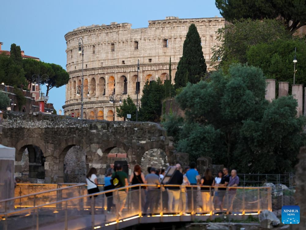 Tourists visit the Imperial Forum during a night tour in Rome, Italy, July 5, 2025. The Imperial Forum has opened to visitors on every Friday, Saturday and Sunday evening since June 20 and will last until September 28. (Photo: Xinhua)