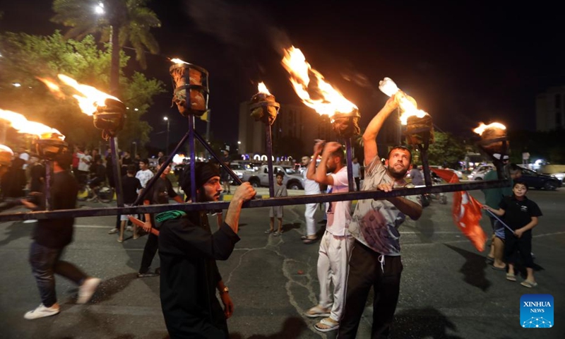 People participate in commemorative activity on the occasion of Ashura, in Baghdad, Iraq, on July 5, 2025. Ashura takes place on the 10th day of Muharram, the first month in the Islamic lunar calendar. (Photo: Xinhua)
