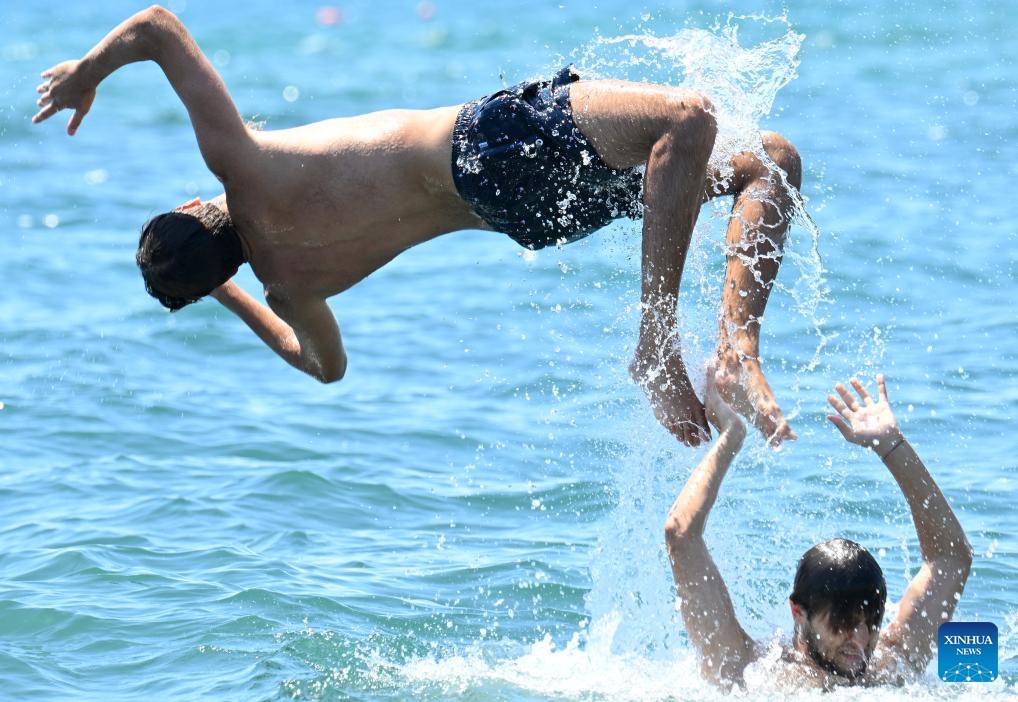 People on a boat enjoy the sea during a heatwave in Ladispoli, Rome, Italy, July 5, 2025. (Photo: Xinhua)
