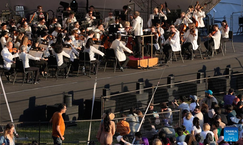Musicians of the Vancouver Symphony Orchestra perform during the Symphony at Sunset concert at Sunset Beach Park in Vancouver, British Columbia, Canada, July 5, 2025. (Photo: Xinhua)