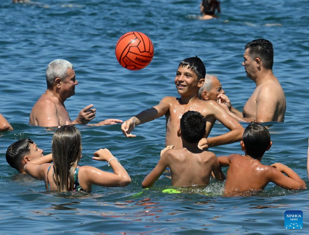 People cool off in the sea during a heatwave in Ladispoli, Rome, Italy, July 5, 2025. (Photo: Xinhua)