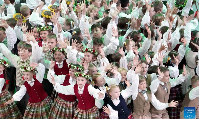 Participants perform during the 13th Latvian School Youth Song and Dance Festival in Riga, Latvia, July 5, 2025. The festival, which is held every five years, is one of the biggest children's and youth culture and art event in the country. (Photo: Xinhua)