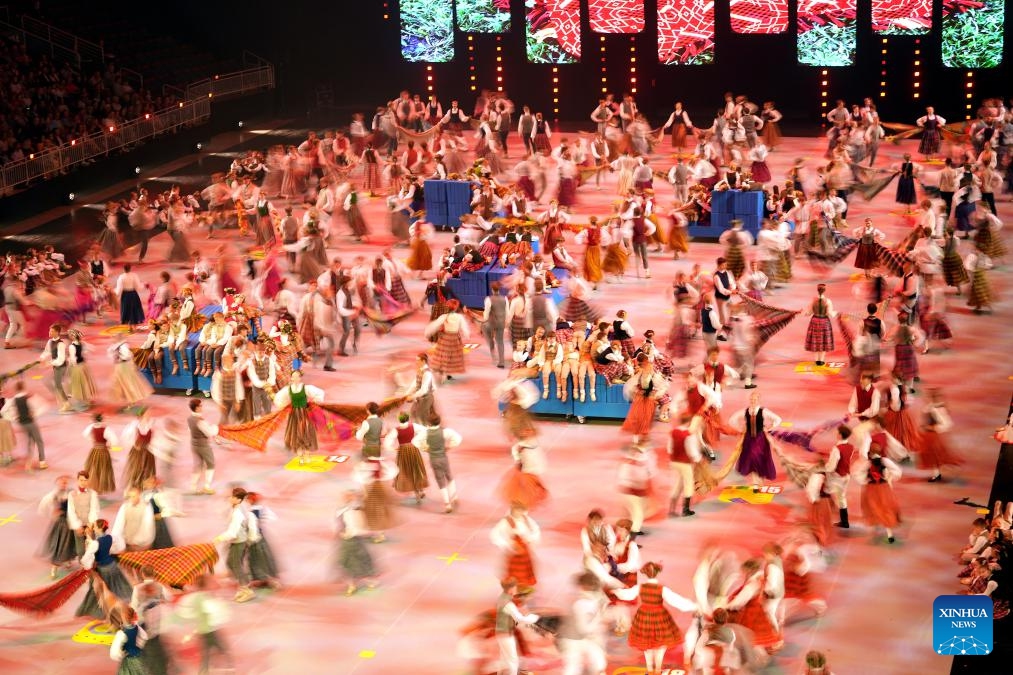 Participants perform during the 13th Latvian School Youth Song and Dance Festival in Riga, Latvia, July 5, 2025. The festival, which is held every five years, is one of the biggest children's and youth culture and art event in the country. (Photo: Xinhua)