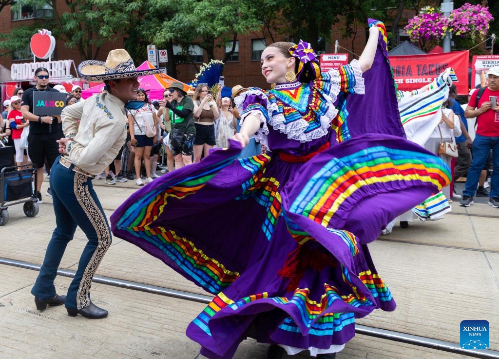 Dressed-up dancers take part in a dance parade during the 2025 Salsa on St. Clair Street Festival in Toronto, Canada, on July 5, 2025. As one of the largest Latino-themed cultural celebrations in Canada, the two-day annual festival kicked off here on Saturday. (Photo: Xinhua)
