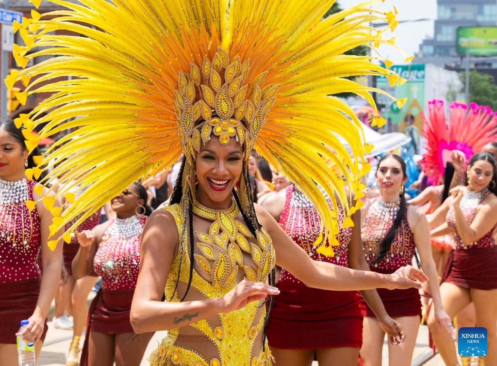 A dressed-up dancer takes part in a dance parade during the 2025 Salsa on St. Clair Street Festival in Toronto, Canada, on July 5, 2025. As one of the largest Latino-themed cultural celebrations in Canada, the two-day annual festival kicked off here on Saturday. (Photo: Xinhua)