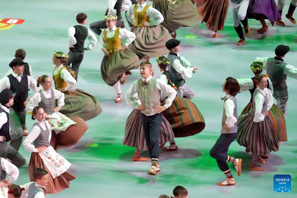 Participants perform during the 13th Latvian School Youth Song and Dance Festival in Riga, Latvia, July 5, 2025. The festival, which is held every five years, is one of the biggest children's and youth culture and art event in the country. (Photo: Xinhua)