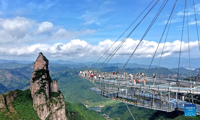 A drone photo taken on July 5, 2025 shows tourists visiting the Shenxianju scenic spot in Xianju County of Taizhou, east China's Zhejiang Province. With the arrival of summer vacation, many places in China have entered the peak tourist season. (Photo: Xinhua)
