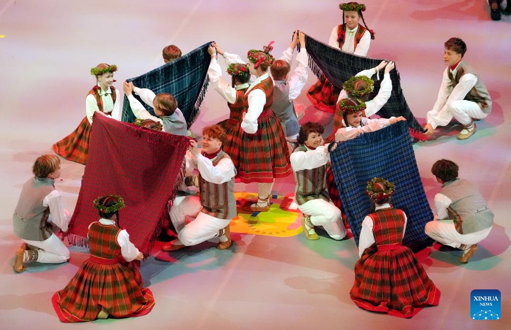 Participants perform during the 13th Latvian School Youth Song and Dance Festival in Riga, Latvia, July 5, 2025. The festival, which is held every five years, is one of the biggest children's and youth culture and art event in the country. (Photo: Xinhua)