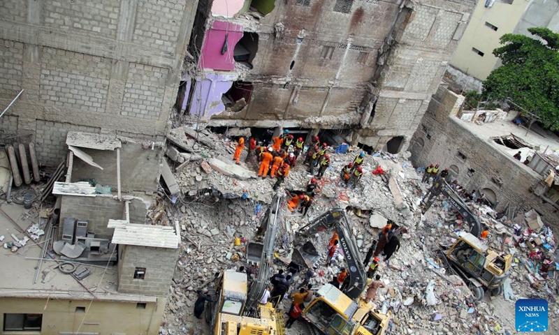 Rescuers work at the scene of a residential building collapse in Karachi, Pakistan, July 5, 2025. The death toll in the building collapse in Pakistan's southern port city of Karachi has jumped to 27 as rescuers retrieved more bodies, a spokesperson of the state-owned rescue organization Rescue 1122 said on Sunday. (Photo: Xinhua)