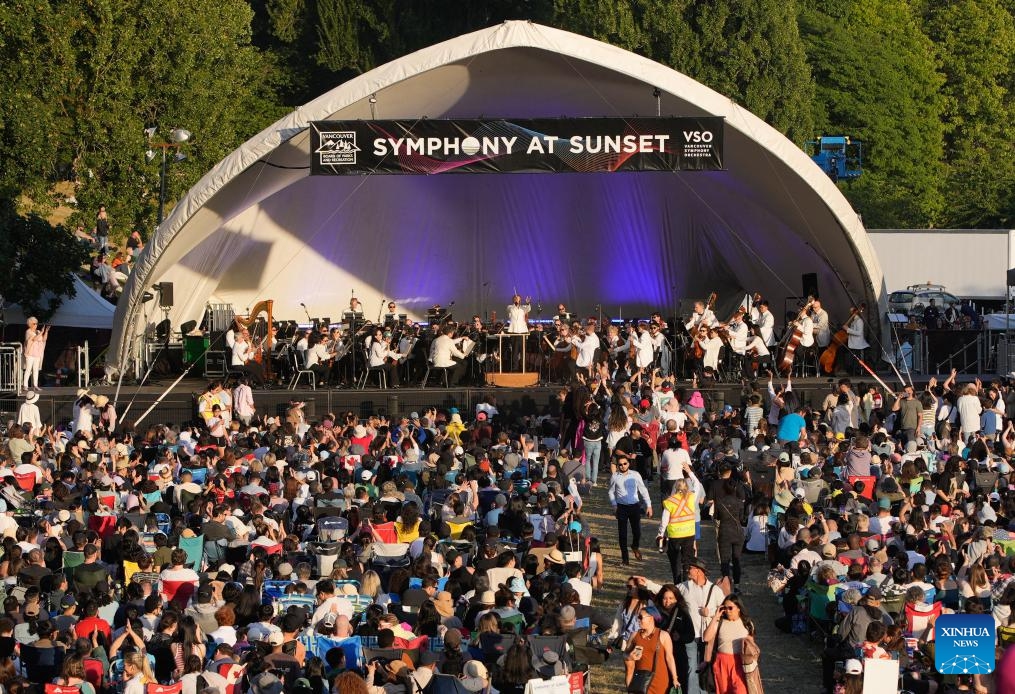Musicians of the Vancouver Symphony Orchestra perform during the Symphony at Sunset concert at Sunset Beach Park in Vancouver, British Columbia, Canada, July 5, 2025. (Photo: Xinhua)