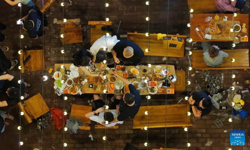 A drone photo shows visitors enjoying food and beer at the 23rd Harbin International Beer Festival in Harbin, northeast China's Heilongjiang Province, July 5, 2025. The beer festival kicked off here Saturday night, showcasing more than 1,000 varieties of beer from over 10 countries and regions. (Photo: Xinhua)