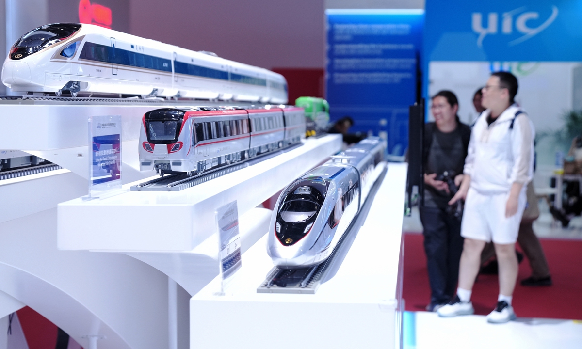 Visitors view various train models, including a CR450 bullet train prototype developed by the China Academy of Railway Sciences, at the 17th China International Modern Railways Exhibition, held alongside the 12th World Congress on High-Speed Rail, at the China National Convention Center in Beijing on July 9, 2025. Photo: VCG