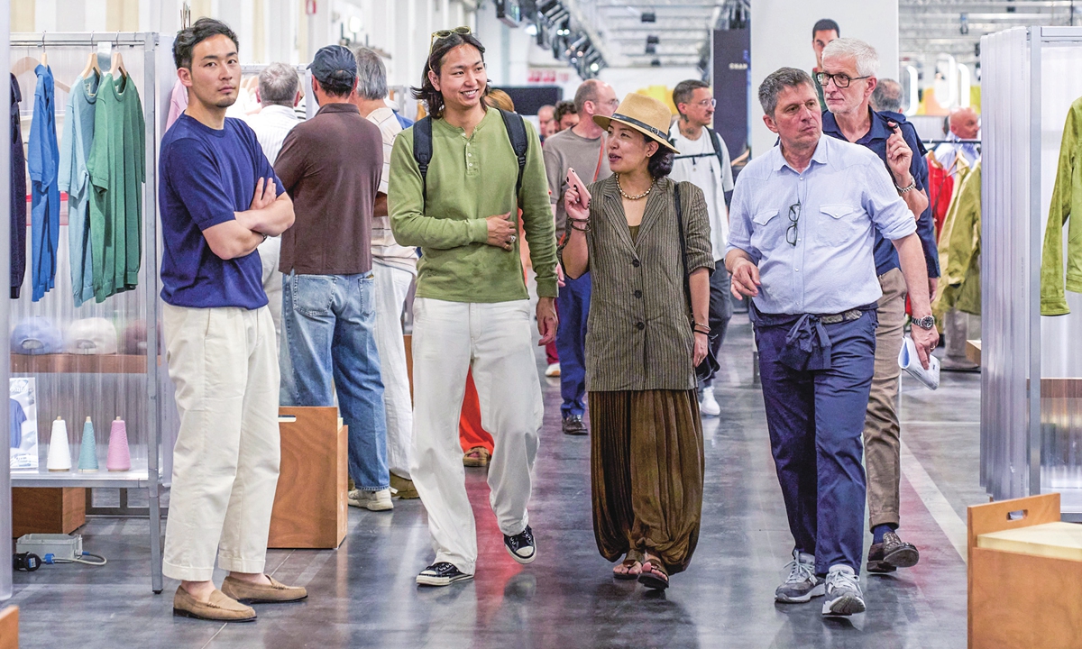 Customers explore a floor of men's fashion Photo: Courtesy of Pitti Uomo 