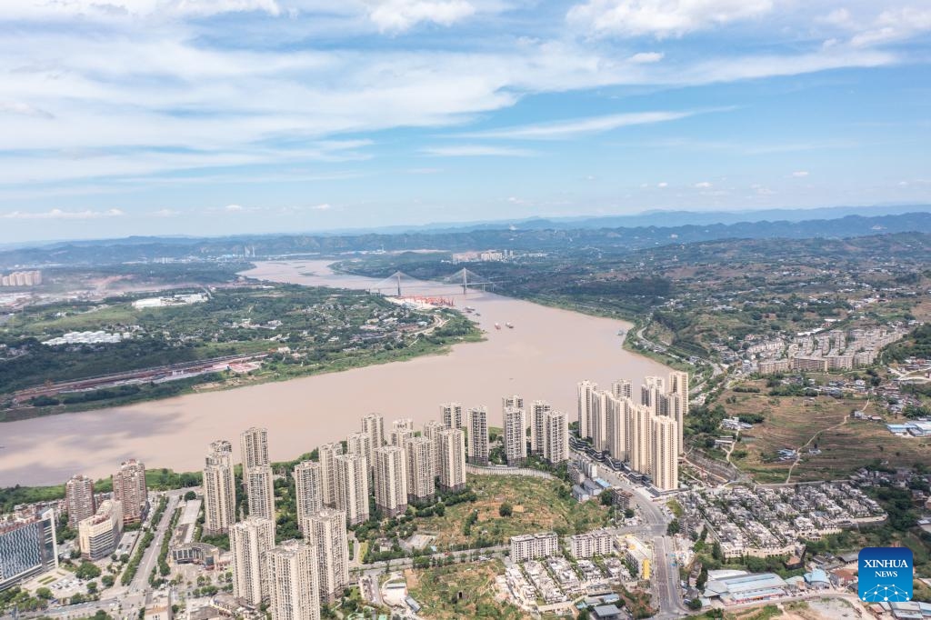 This aerial drone photo taken on July 3, 2025 shows the view of the urban area in Jiangjin District of southwest China's Chongqing Municipality. Jiangjin is located in a strategic point along the Yangtze River. City buildings have been constructed along the slopes on the river banks. From a distance, they appear like a forest growing from the cliffs. In recent years, Jiangjin has promoted the ecological management of the Yangtze River. The improvement of water quality has attracted rare fish species to return. (Photo: Xinhua)