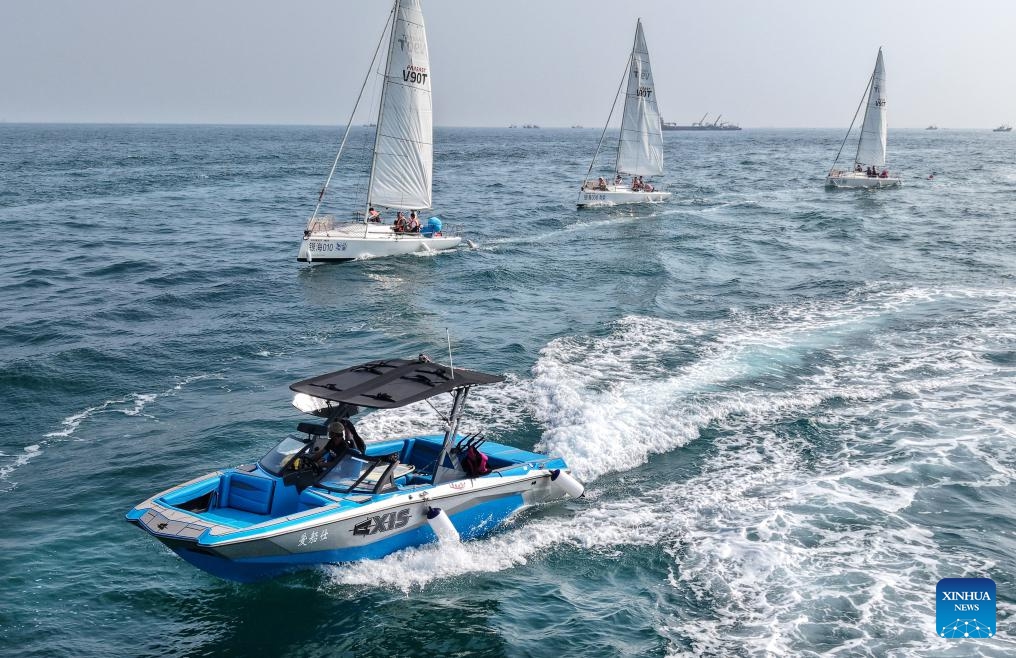 A drone photo taken on July 10, 2025 shows a yacht and sailboats participating in a sea cruising event in Laolong Bay area in Qingdao, east China's Shandong Province. A sea cruising event was held in the coastal city of Qingdao on Thursday to celebrate the 20th anniversary of the establishment of the Maritime Day of China and the 620th anniversary of Chinese explorer Zheng He's maritime voyages. (Photo: Xinhua)