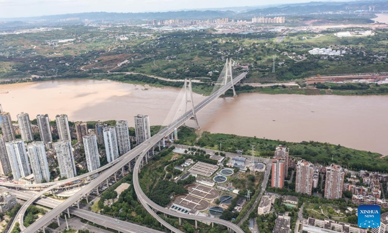 This aerial drone photo taken on July 3, 2025 shows the view of the urban area in Jiangjin District of southwest China's Chongqing Municipality. Jiangjin is located in a strategic point along the Yangtze River. City buildings have been constructed along the slopes on the river banks. From a distance, they appear like a forest growing from the cliffs. In recent years, Jiangjin has promoted the ecological management of the Yangtze River. The improvement of water quality has attracted rare fish species to return. (Photo: Xinhua)