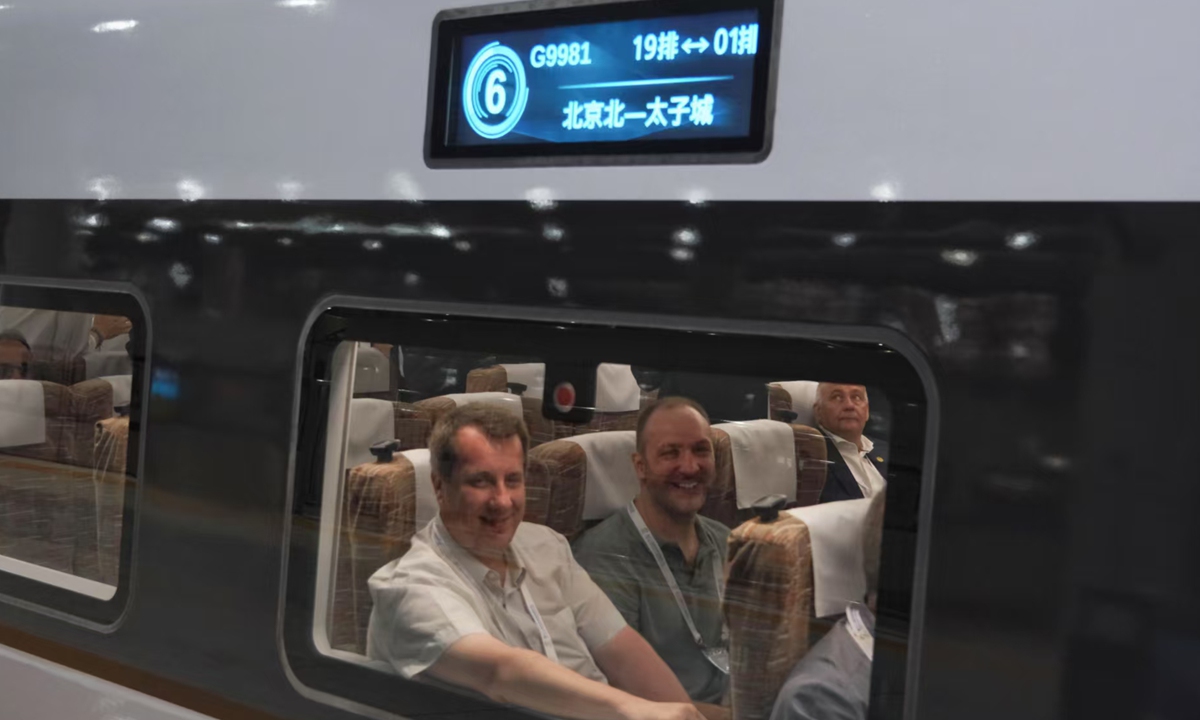 International representatives and guests attending the 12th World Congress on High-Speed Rail take the Beijing-Zhangjiakou High-Speed Railway from Beijing North Station to visit Taizicheng, the venue of the 2022 Winter Olympics in Hebei Province on July 11, 2025, experiencing the advanced technology and speed of Chinese high-speed rail. Photo: VCG