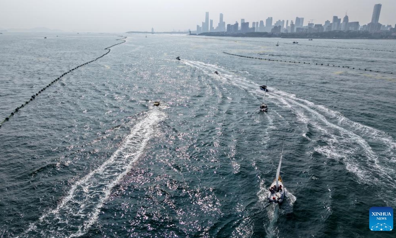 An aerial drone photo taken on July 10, 2025 shows yachts and sailboats participating in a sea cruising event in Laolong Bay area in Qingdao, east China's Shandong Province. A sea cruising event was held in the coastal city of Qingdao on Thursday to celebrate the 20th anniversary of the establishment of the Maritime Day of China and the 620th anniversary of Chinese explorer Zheng He's maritime voyages. (Photo: Xinhua)
