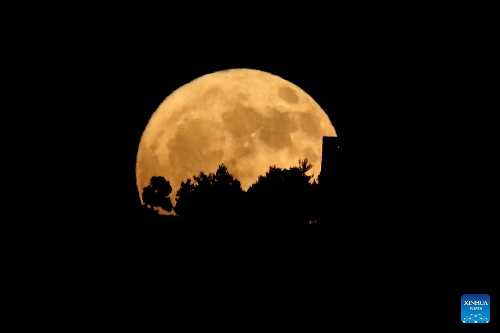 A full moon rises in the sky over Ajloun, north of Amman, Jordan on July 10, 2025. (Photo: Xinhua)