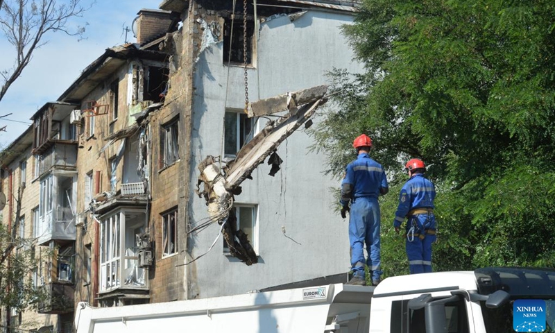 Emergency workers demolish a damaged residential building at the site of an air strike in the Shevchenkivskyi district of Kiev, Ukraine, July 10, 2025. Russia's overnight strike on Kiev on Thursday killed at least two people and injured 16 others, local authorities said. The attack damaged eight of Kiev's 10 districts, hitting residential buildings, along with medical, educational, commercial and transport infrastructure. (Photo: Xinhua)