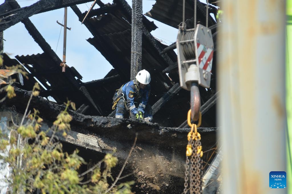 An emergency worker demolishes a damaged residential building at the site of an air strike in the Shevchenkivskyi district of Kiev, Ukraine, July 10, 2025. Russia's overnight strike on Kiev on Thursday killed at least two people and injured 16 others, local authorities said. The attack damaged eight of Kiev's 10 districts, hitting residential buildings, along with medical, educational, commercial and transport infrastructure. (Photo: Xinhua)