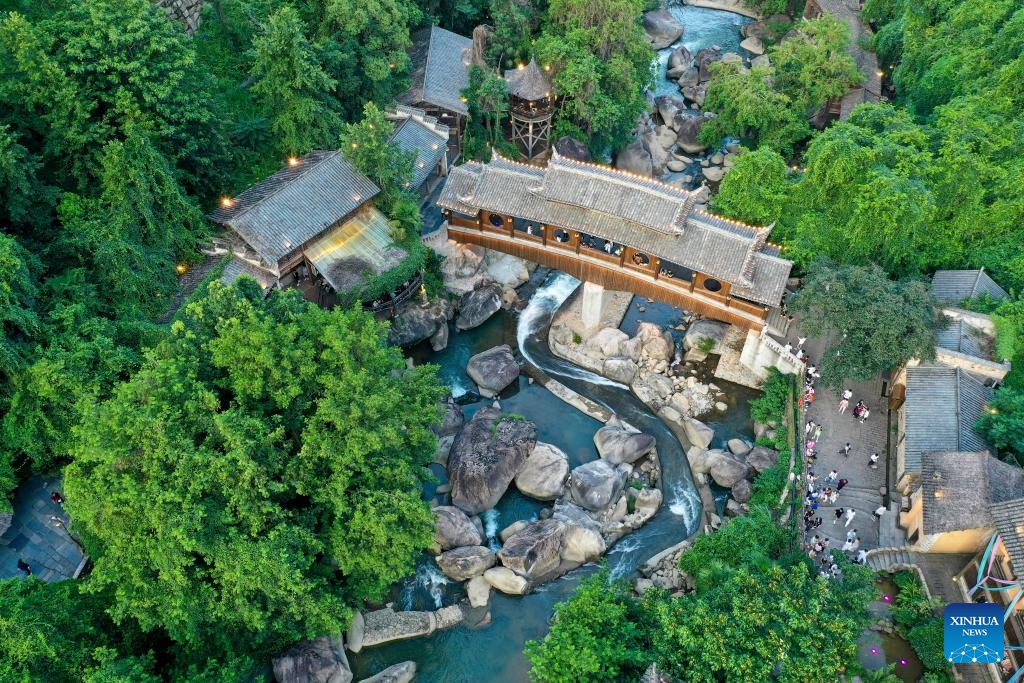 An aerial drone photo shows the Wangxian Valley Scenic Spot in Wangxian Township of Shangrao City, east China's Jiangxi Province, July 11, 2025. Once a granite mining quarry, Wangxian Valley has been transformed into a popular tourist destination following a government ban on disorderly mining, with its natural cliffs creatively repurposed into attractions such as cliffside hotels, cliff skywalks and waterfalls. (Photo: Xinhua)