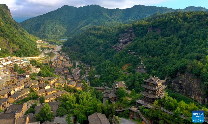 An aerial drone photo shows the Wangxian Valley Scenic Spot in Wangxian Township of Shangrao City, east China's Jiangxi Province, July 12, 2025. Once a granite mining quarry, Wangxian Valley has been transformed into a popular tourist destination following a government ban on disorderly mining, with its natural cliffs creatively repurposed into attractions such as cliffside hotels, cliff skywalks and waterfalls. (Photo: Xinhua)