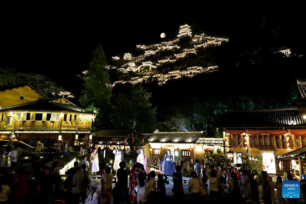 Tourists visit the Wangxian Valley Scenic Spot in Wangxian Township of Shangrao City, east China's Jiangxi Province, July 11, 2025. Once a granite mining quarry, Wangxian Valley has been transformed into a popular tourist destination following a government ban on disorderly mining, with its natural cliffs creatively repurposed into attractions such as cliffside hotels, cliff skywalks and waterfalls. (Photo: Xinhua)