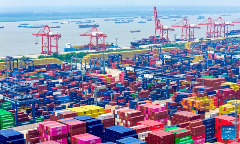 This aerial drone photo taken on July 10, 2025 shows a view of Longtan Container Terminal of Nanjing Port in Nanjing, east China's Jiangsu Province. China's maritime industry now handles nearly one-third of global maritime shipping volume, according to the 2025 China Maritime Day Forum held in the coastal town of Boao in south China's Hainan Province on Friday. China's booming marine economy is driving sustained and stable growth in global trade and development. (Photo: Xinhua)