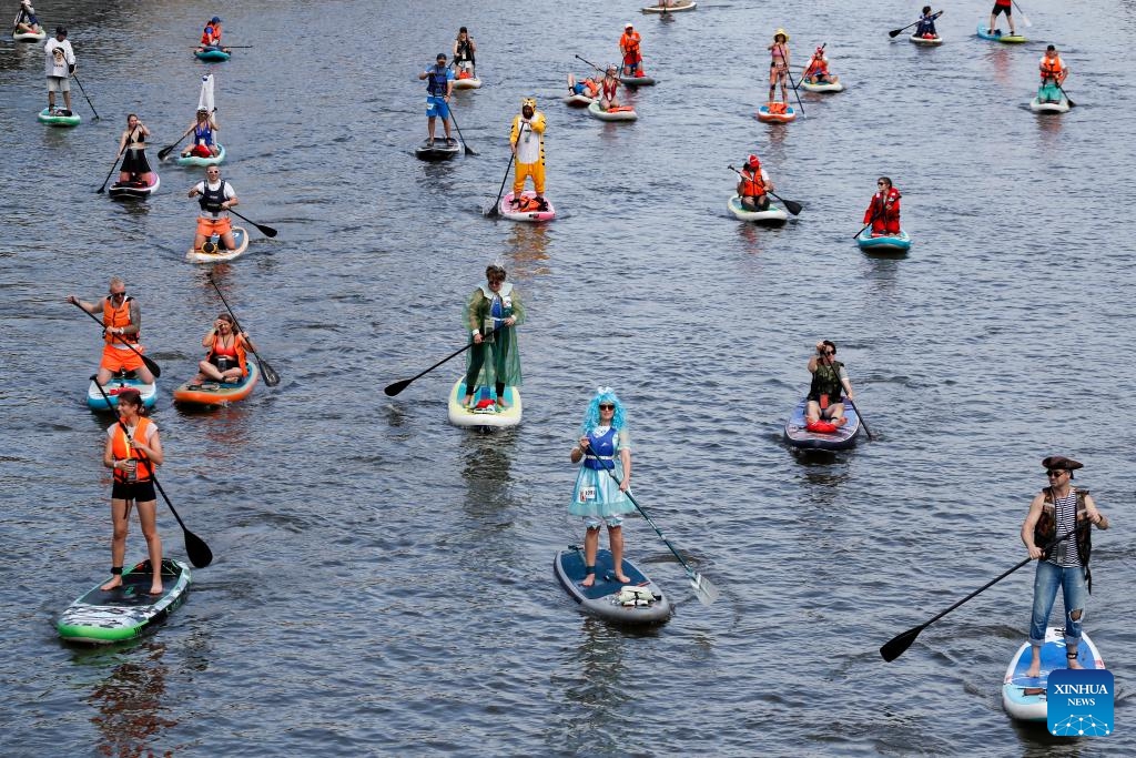 Participants take part in the SUP (Stand Up Paddling) parade in Moscow, Russia, July 13, 2025. (Photo: Xinhua)