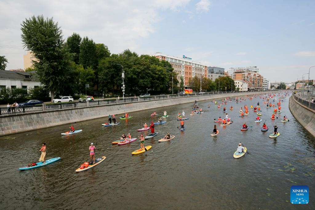 Participants take part in the SUP (Stand Up Paddling) parade in Moscow, Russia, July 13, 2025. (Photo: Xinhua)