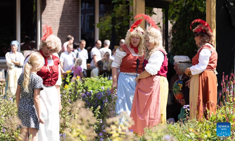 People dressed in vintage clothing celebrate Rembrandt Days in Leiden, the Netherlands, on July 12, 2025. Rembrandt Days is an annual summer festival in Leiden, celebrating the legacy of Dutch painter Rembrandt, who was born in Leiden. This year's Rembrandt Days are celebrated on July 12 and 13. (Photo: Xinhua)