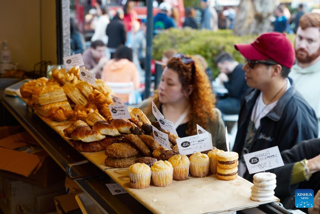 People visit a dessert stand at a food festival in Buenos Aires, Argentina, on July 12, 2025. A two-day food festival was held to celebrate Argentina's Independence Day in Buenos Aires. (Photo: Xinhua)