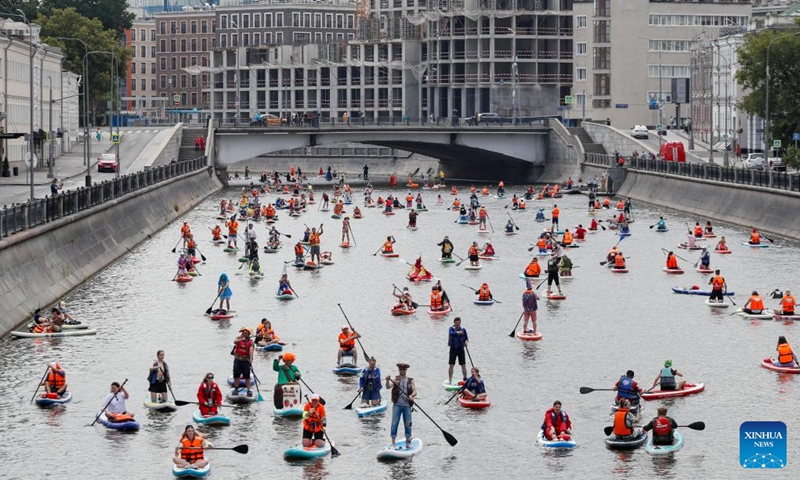 Participants take part in the SUP (Stand Up Paddling) parade in Moscow, Russia, July 13, 2025. (Photo: Xinhua)
