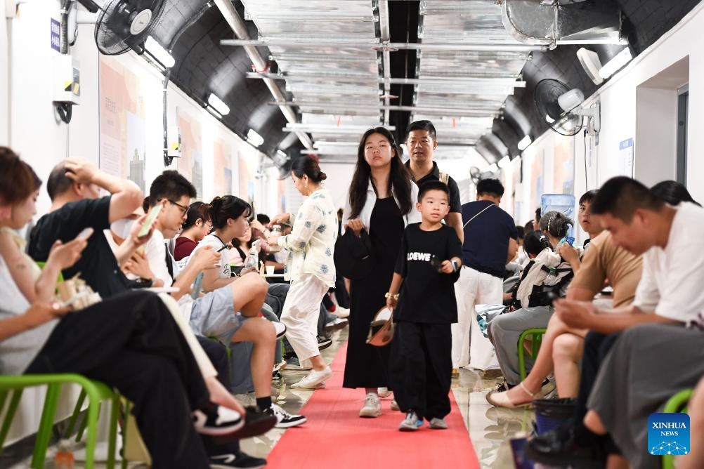 Residents cool off at an air-raid shelter in Nanjing, east China's Jiangsu Province, July 13, 2025. A heatwave is sweeping multiple regions in China, prompting authorities to roll out measures to ensure job safety and stable production. (Photo: Xinhua)