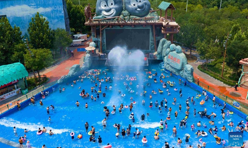 An aerial drone photo taken on July 12, 2025 shows people having fun at a water park in Binhai New Area, north China's Tianjin Municipality. With heatwaves hitting some Chinese provinces and regions in recent days, the scorching temperature has fueled a cooling economy boom. (Photo: Xinhua)