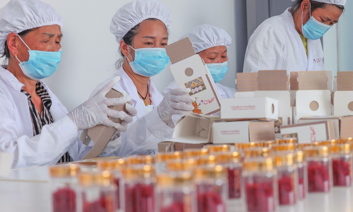 Workers package saffron for export in a company in Tongren, Southwest China's Guizhou Province on July 14, 2025. The county is developing its saffron industry and has established a complete industrial chain, from research and development to sales. In addition to domestic sales, the products are also exported to South Korea, Vietnam, and Germany. 
·Photo: VCG