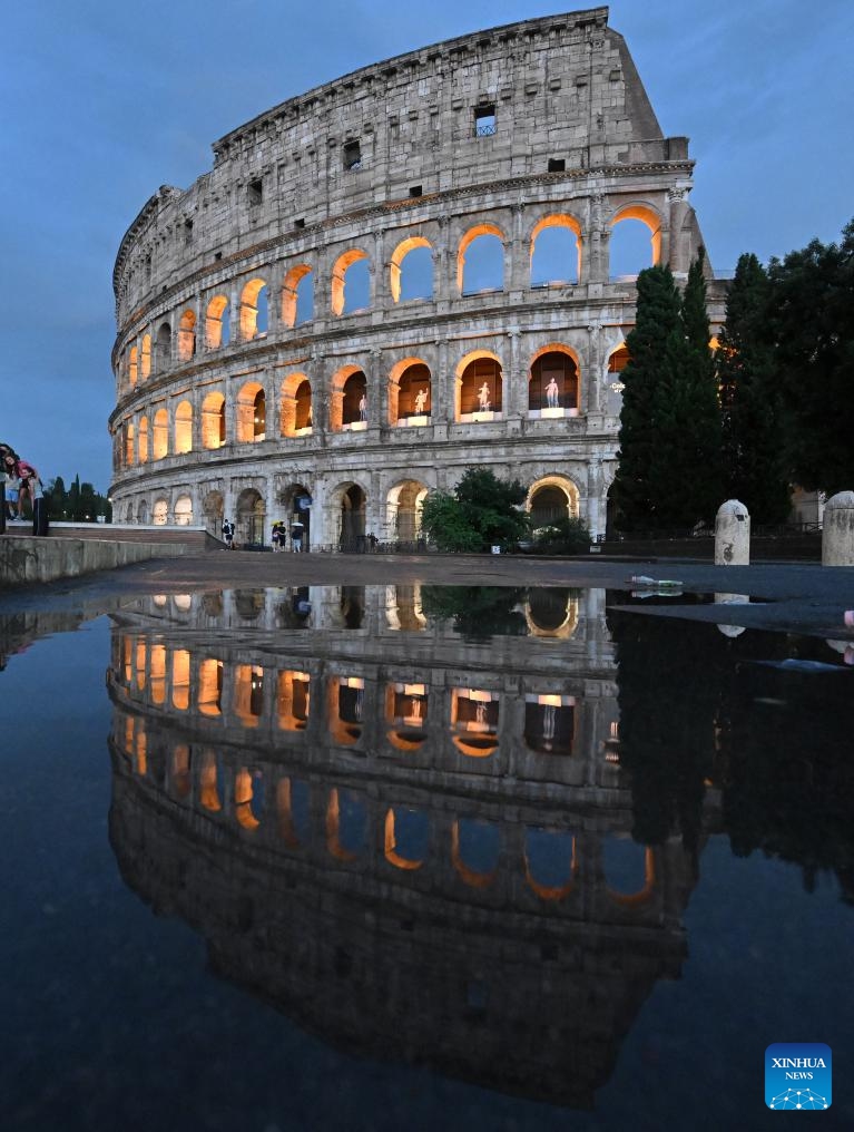 This photo taken on July 13, 2025 shows the Colosseum and its reflection in a puddle after rain in Rome, Italy. (Photo: Xinhua)