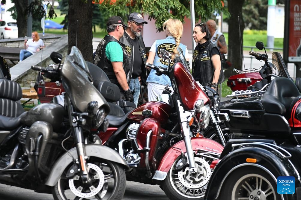 Motorcyclists chat during Narva Bike 2025 in Narva, Estonia, July 12, 2025. The popular biker festival kicked off in the Estonian city of Narva on Friday. More than 1,000 motorcycle enthusiasts from across Europe and beyond gathered at the medieval Narva Castle for a three-day event. (Photo: Xinhua)
