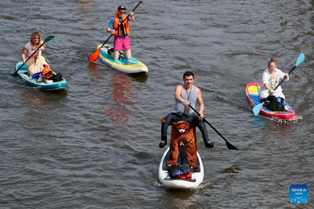 Participants take part in the SUP (Stand Up Paddling) parade in Moscow, Russia, July 13, 2025. (Photo: Xinhua)