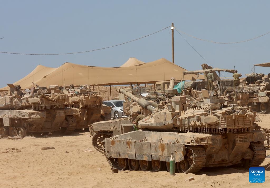 Israeli military vehicles are seen near the southern Israeli border with Gaza Strip on July 13, 2025. At least 58 Palestinians were killed by Israeli airstrikes and gunfire across the Gaza Strip on Sunday, Palestinian sources said. Mahmoud Basal, spokesperson for the Civil Defense in Gaza, told Xinhua that at least 15 people, including a doctor and a child, were killed in an Israeli airstrike targeting a crowded market in central Gaza City. (Photo: Xinhua)