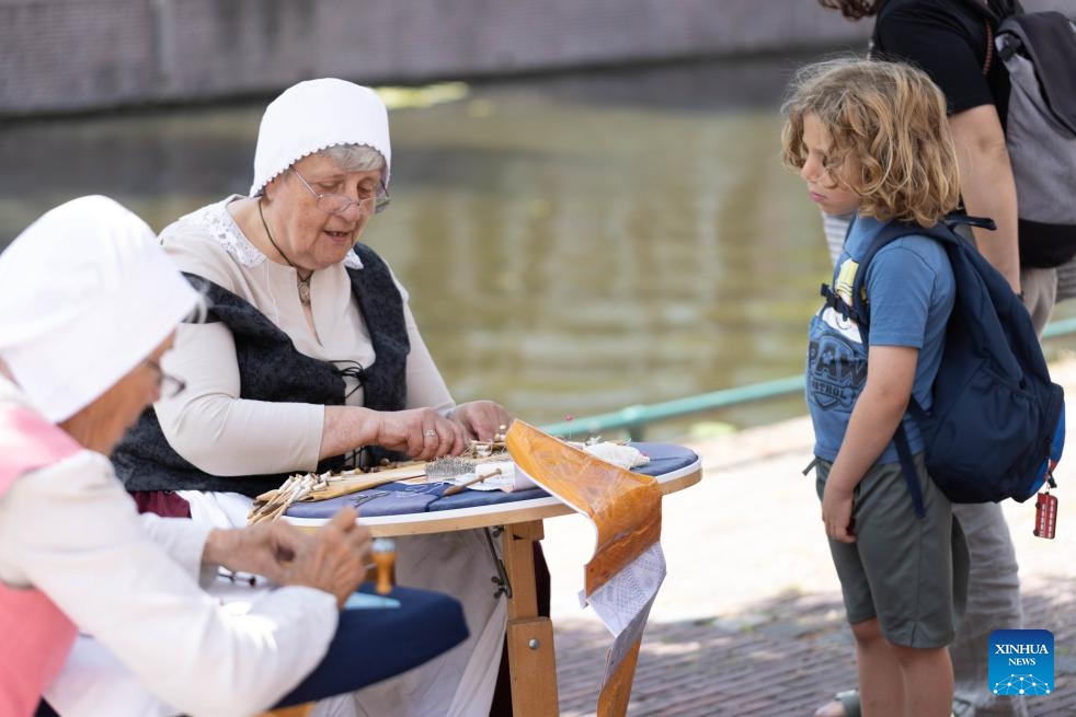 People dressed in vintage clothing celebrate Rembrandt Days in Leiden, the Netherlands, on July 12, 2025. Rembrandt Days is an annual summer festival in Leiden, celebrating the legacy of Dutch painter Rembrandt, who was born in Leiden. This year's Rembrandt Days are celebrated on July 12 and 13. (Photo: Xinhua)