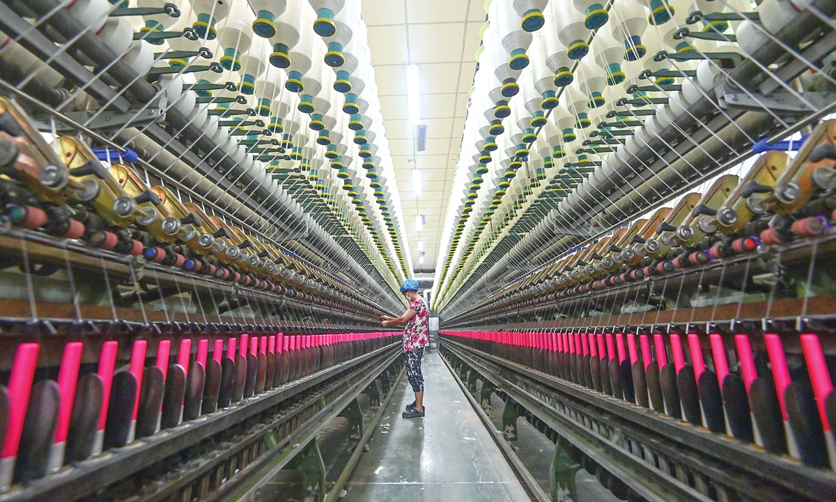 An employee works on the yarn processing line at a textile manufacturing company in Qingzhou, East China's Shandong Province, on July 15, 2025. From January to June this year, the value-added industrial output of enterprises above designated size increased by 6.4 percent year-on-year. In June alone, the growth rate reached 6.8 percent.
Photo: VCG