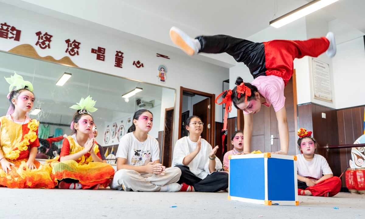 Students from Xichang Primary School practice Peking Opera under the guidance of their instructor during a summer camp in Hai'an, East China's Jiangsu Province, on July 17, 2025. Professional opera actors from local troupes provided free lessons, helping students immerse themselves in the charm of this national cultural treasure and enriching their summer vacation. Photo: VCG