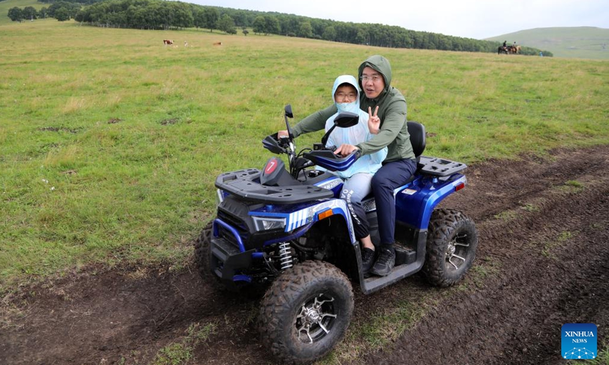 Tourists ride a grassland sightseeing vehicle on a grassland in Hexigten Banner of Chifeng City, north China's Inner Mongolia Autonomous Region, July 24, 2025. (Xinhua/Hou Jun)


