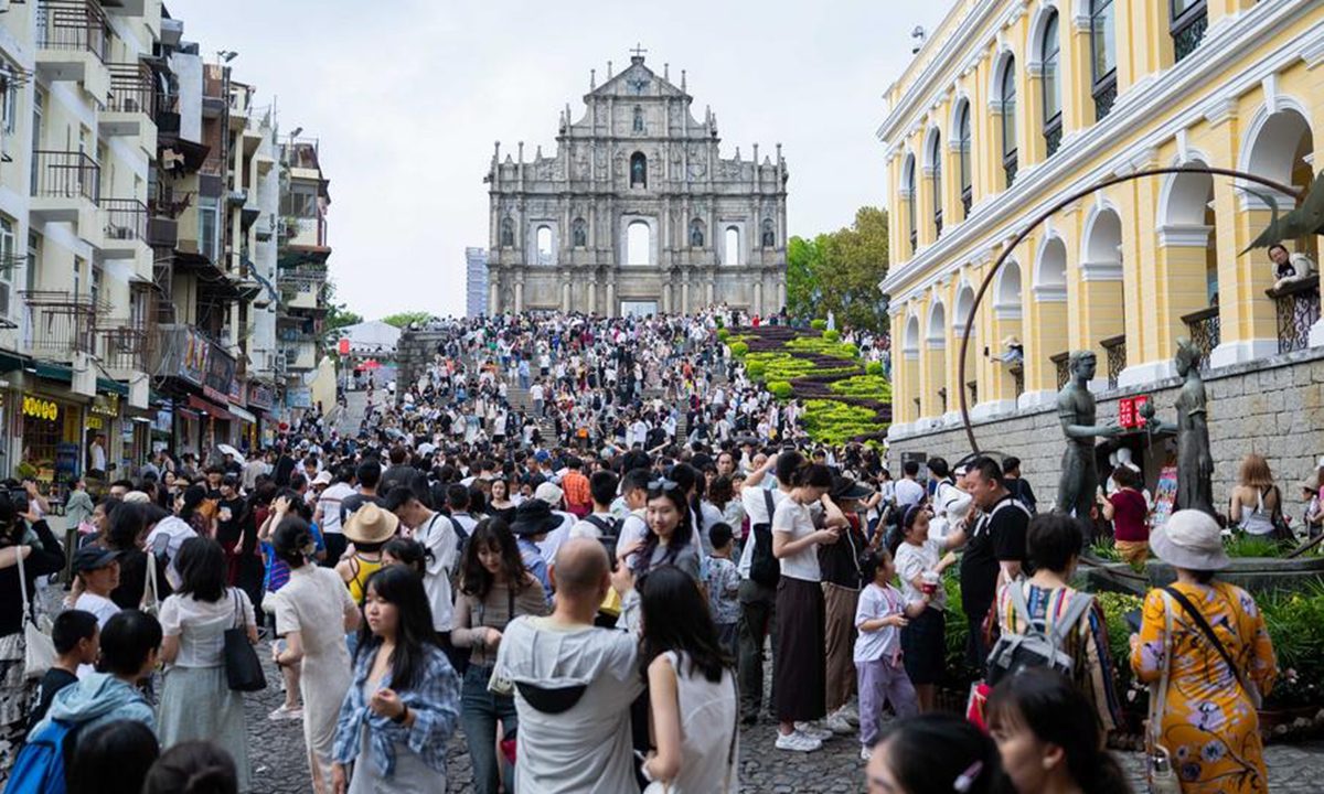 Tourists are pictured near the Ruins of St. Paul's in south China's Macao, May 3, 2025 (Xinhua/Cheong Kam Ka)
