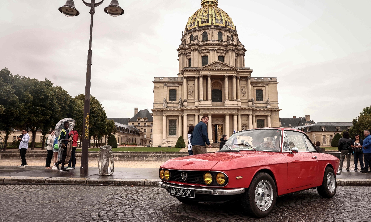A vintage classic Lancia Fluvia Coupe car, produced in the 1960s, sits in front of the Hotel Des Invalides during the 