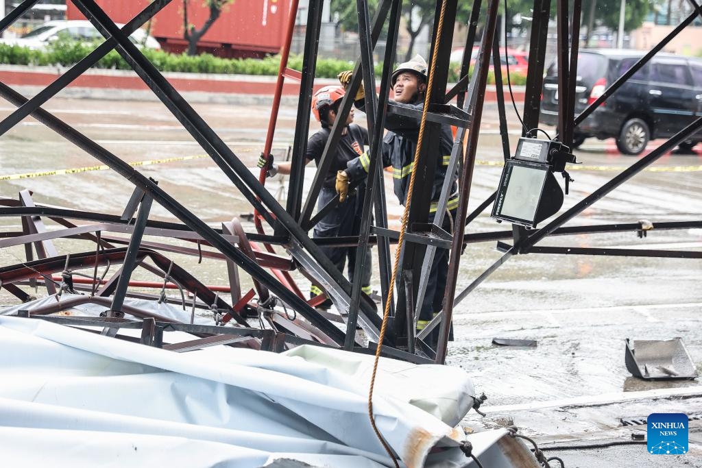 Rescuers work on the site of a billboard collapse due to strong winds in Quezon City, the Philippines, on July 19, 2025. Wipha intensified into a severe tropical storm as it blew away from the Philippines on Saturday, bringing strong winds and heavy rains to many areas. (Photo: Xinhua)