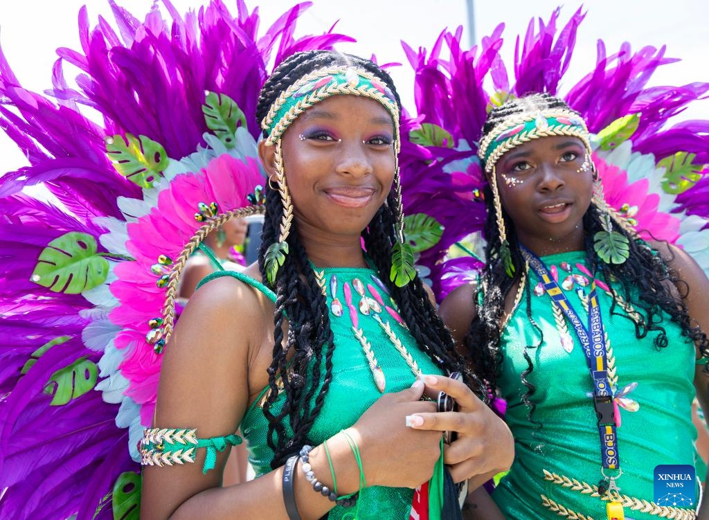 Dressed-up girls pose for photos during the Junior Carnival Parade of the 2025 Toronto Caribbean Carnival in Toronto, Canada, on July 19, 2025. The annual event kicked off here on Saturday with thousands of young participants in vibrant costumes celebrating Caribbean culture with music and dance. (Photo: Xinhua)