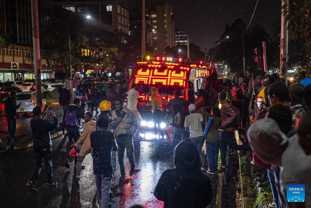 People cheer around a matatu as it plays music in Nairobi, Kenya, on July 18, 2025. Popularly known as matatus, the privately owned minibuses are the main means of public transport plying various routes in this East Africa country. Matatus are famous for their bold graffiti, vibrant music, and artistic designs. The energetic vibe they bring reflects the urban culture and hustle of the city. (Photo: Xinhua)